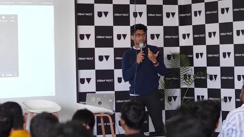 Mishal Abdullah speaking to an audience with a microphone